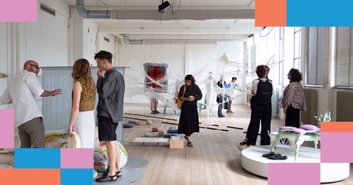 Visitors discussing work in an assessment exhibition
