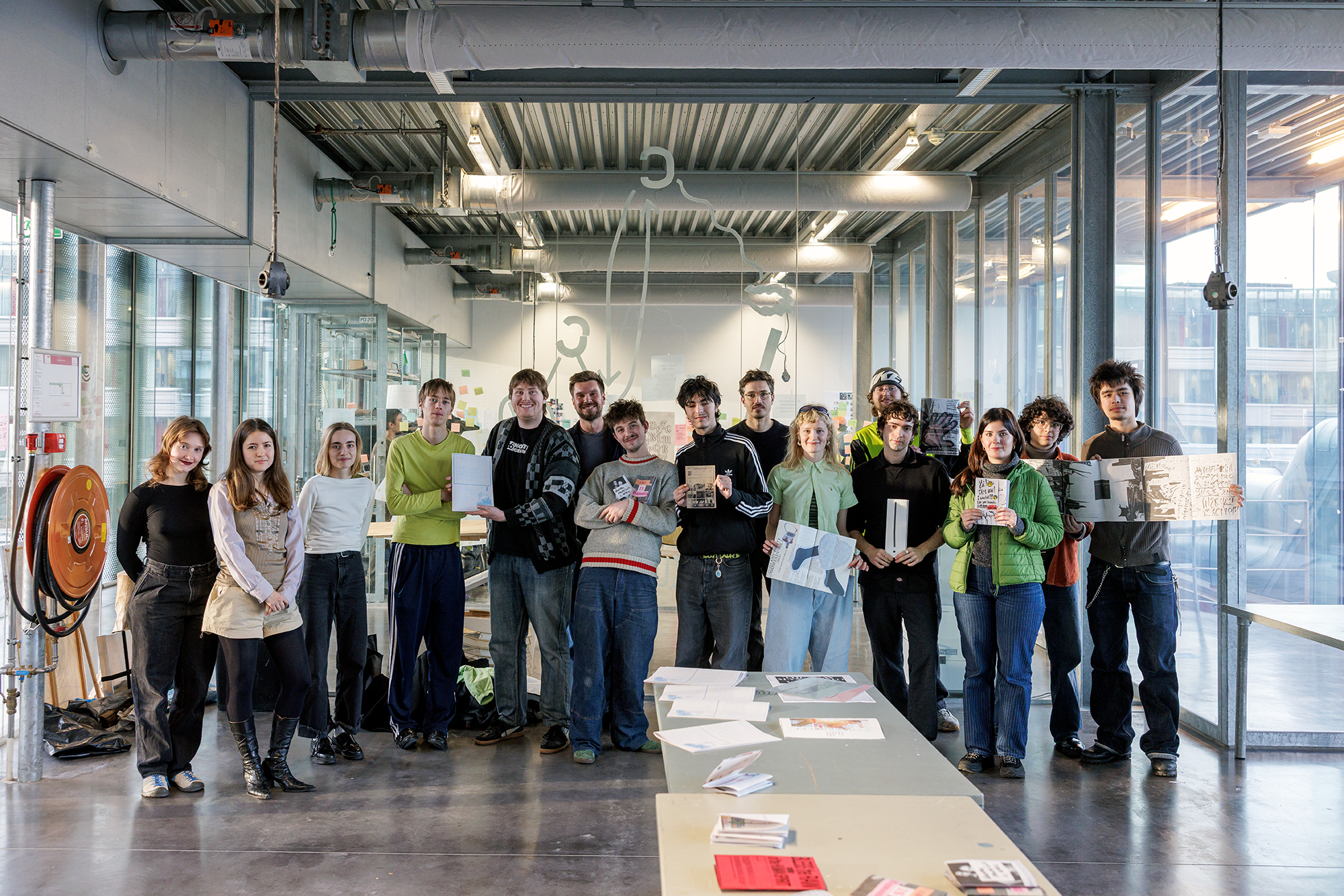 Graphic Design students holding up their publications