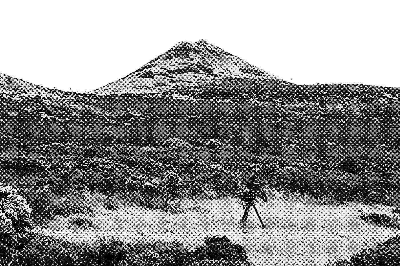 Halftone photo of a radio recording kit on a tripod below Great Sugar Loaf