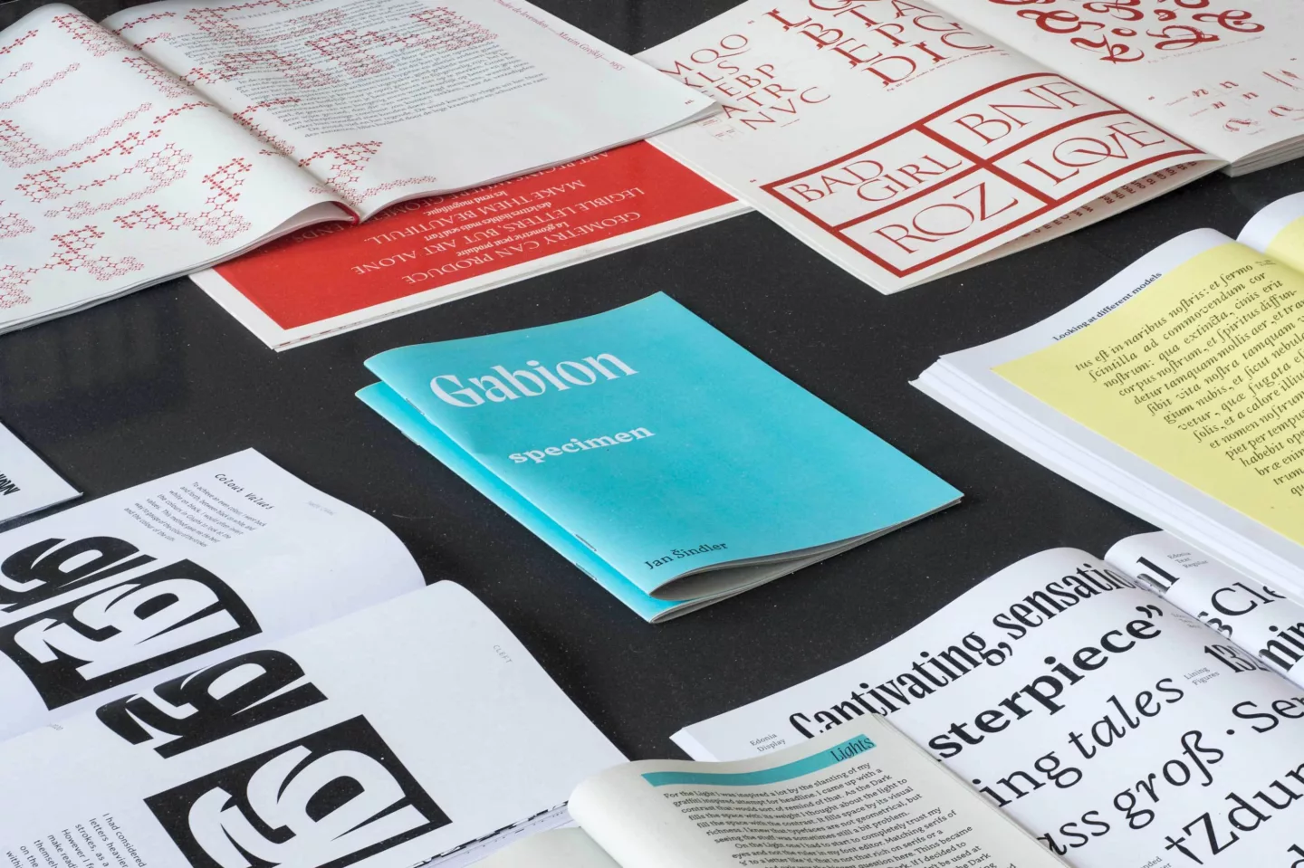 Type specimens and typography publications on a table